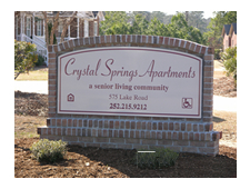 A sign that reads Crystal Spring Apartments.