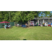 A yard full of tables and booths showcasing many different services.