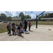 Children in two lines getting ready to play basketball.