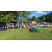 Many tables and booths set up in the grass to showcase different services.