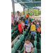 The children gathering around the Wood Duck Baseball mascot.