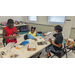 A group of three children working on a project.