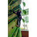 A child rock climbing at an indoor center.