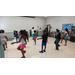 Children working on their dance choreography. 