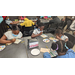 Children at a table working on art projects.