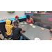 Children sitting at a table and working on art projects.