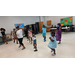 Students in class dancing around. 