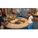 A woman and a child looking at a rock exhibit. 