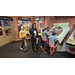 A group of children exploring an exhibit through the glass. 