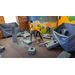 Two children playing with building blocks in a room. 