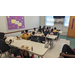 Children eating lunch in a room. 