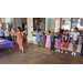 A lady speaking with children lined up behind her. 